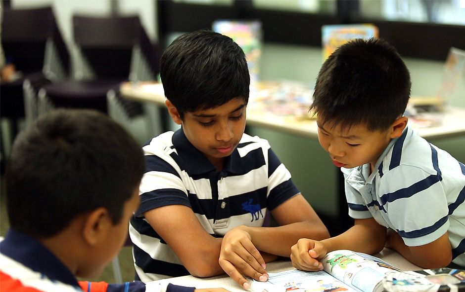 Kids of different nations are reading books